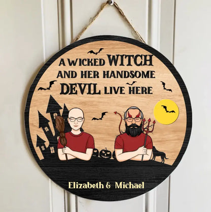 A Wicked Witch And Her Handsome Devil Live Here - Couple Personalized Custom Round Shaped Home Decor Witch Wood Sign - Halloween Gift For Witches, Husband Wife